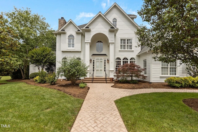 4315 Sugar Pine Ln, Durham, NC 27705 - traditional-style house with a chimney and a front yard