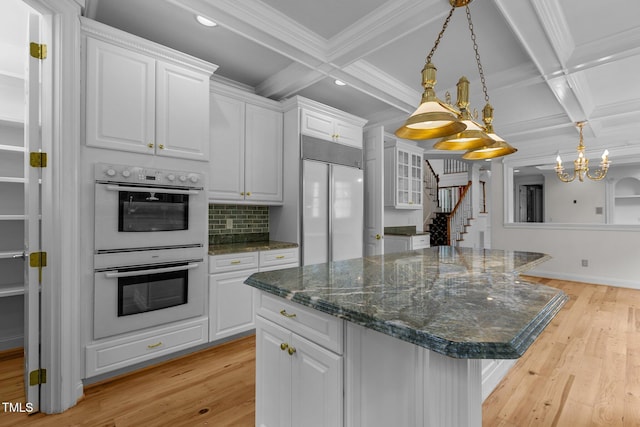 4315 Sugar Pine Ln, Durham, NC 27705 - kitchen with built in refrigerator, double oven, coffered ceiling, decorative backsplash, and recessed lighting