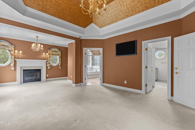 4315 Sugar Pine Ln, Durham, NC 27705 - unfurnished living room with a chandelier, a tray ceiling, crown molding, carpet, and a high end fireplace