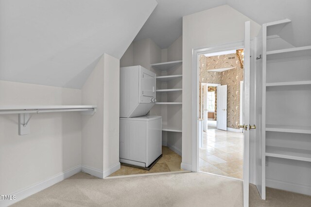 4315 Sugar Pine Ln, Durham, NC 27705 - spacious closet featuring estacked washer and dryer, vaulted ceiling, and light carpet