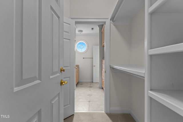 4315 Sugar Pine Ln, Durham, NC 27705 - walk in closet with light tile patterned floors