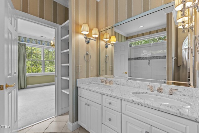 4315 Sugar Pine Ln, Durham, NC 27705 - bathroom with double vanity, tile patterned floors, plenty of natural light, wallpapered walls, and a stall shower