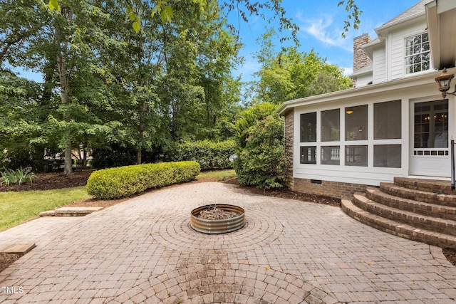 4315 Sugar Pine Ln, Durham, NC 27705 - view of patio with a sunroom and a fire pit