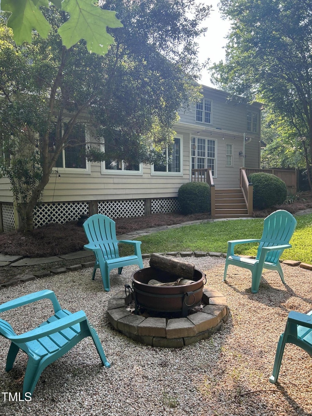 7801 Kingsbrook Ct, Wake Forest, NC 27587 - view of yard with a fire pit and a wooden deck