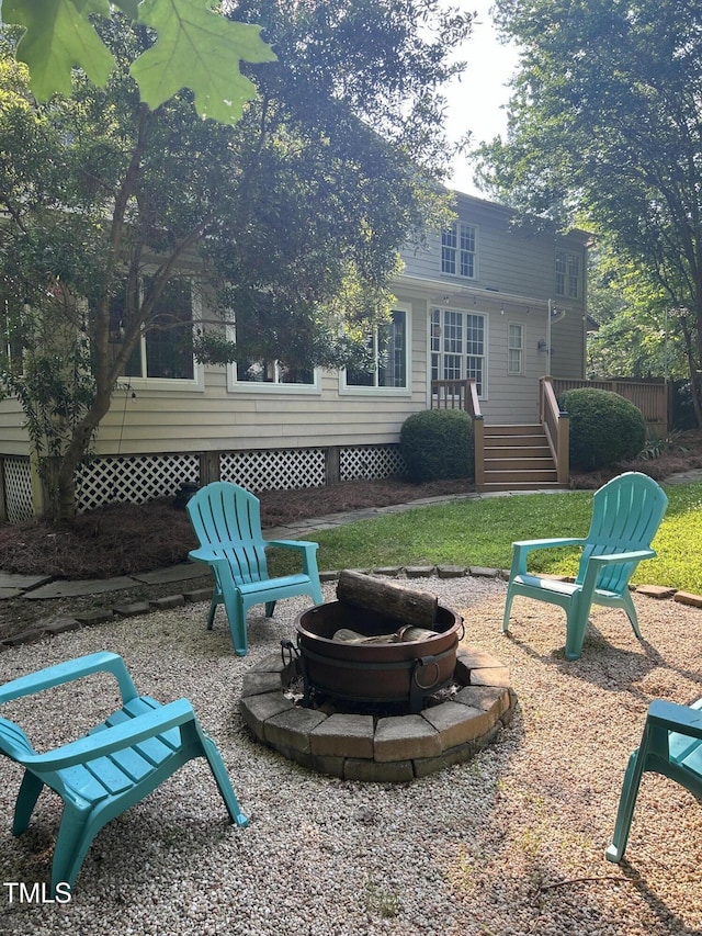 7801 Kingsbrook Ct, Wake Forest, NC 27587 - view of yard with a fire pit and a wooden deck