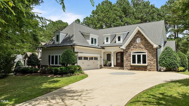 763 Heritage Arbor Dr, Wake Forest, NC 27587 - view of front of property featuring stone siding, driveway, a front yard, roof with shingles, and a garage