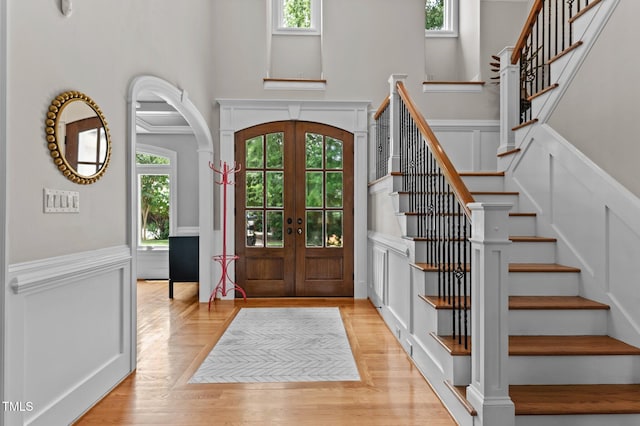763 Heritage Arbor Dr, Wake Forest, NC 27587 - entryway featuring french doors, healthy amount of natural light, arched walkways, stairs, and a towering ceiling