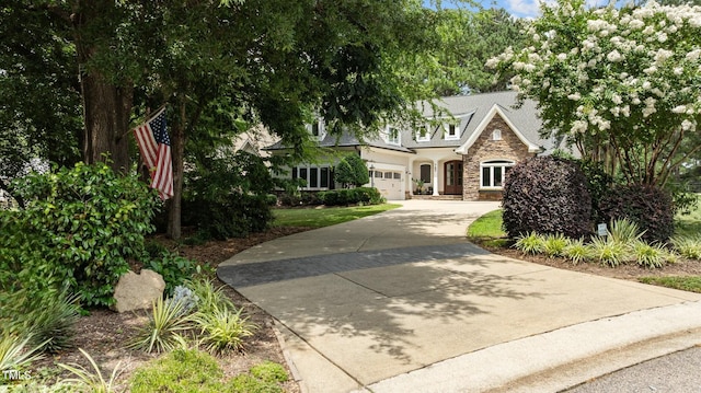 763 Heritage Arbor Dr, Wake Forest, NC 27587 - view of front facade featuring stone siding, an attached garage, and driveway