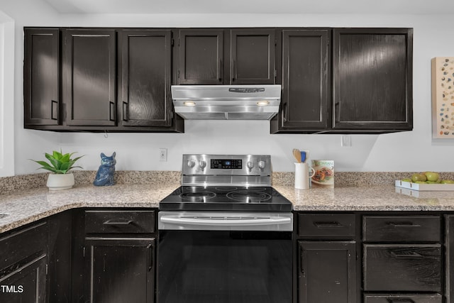 3205 Dell Dr, Raleigh, NC 27609 - kitchen with under cabinet range hood, stainless steel electric range oven, and dark cabinets