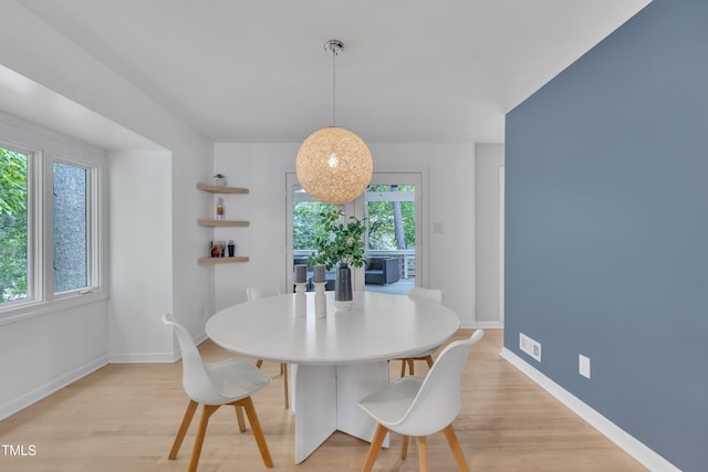 3205 Dell Dr, Raleigh, NC 27609 - dining area with light wood-type flooring and baseboards