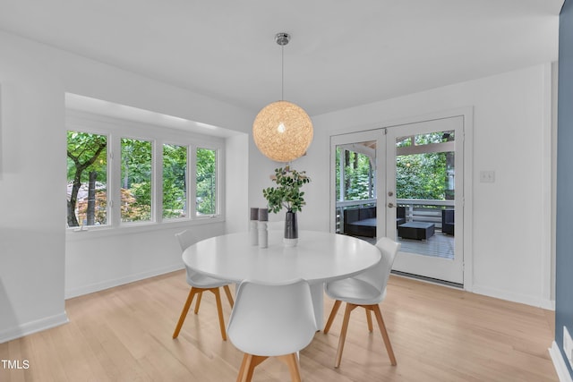 3205 Dell Dr, Raleigh, NC 27609 - dining space with light wood-type flooring and french doors