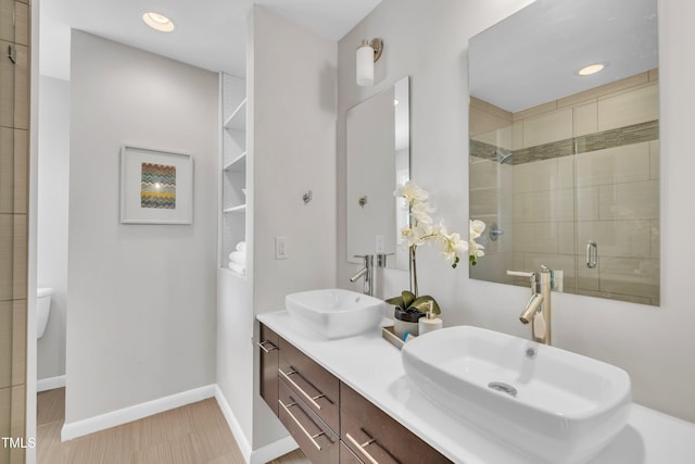 3205 Dell Dr, Raleigh, NC 27609 - full bathroom featuring a shower stall, double vanity, and recessed lighting
