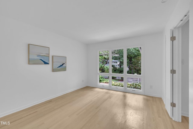 3205 Dell Dr, Raleigh, NC 27609 - empty room with light wood-style floors and baseboards