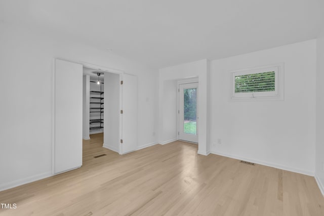 3205 Dell Dr, Raleigh, NC 27609 - empty room featuring light wood-type flooring and baseboards