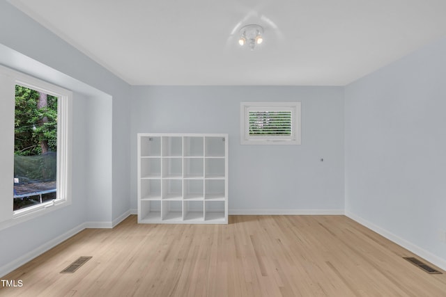 3205 Dell Dr, Raleigh, NC 27609 - spare room featuring light wood finished floors and healthy amount of natural light
