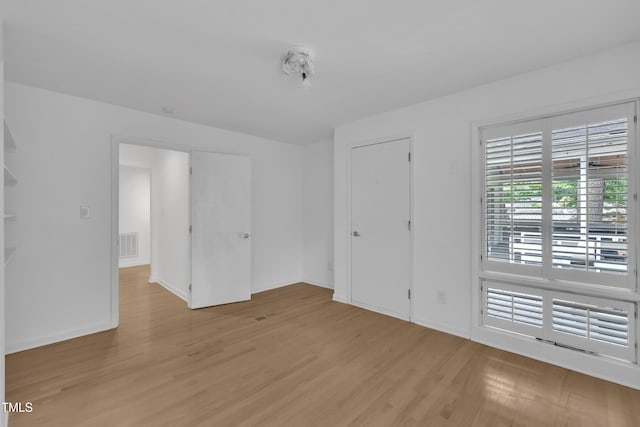 3205 Dell Dr, Raleigh, NC 27609 - empty room with light wood-type flooring and baseboards