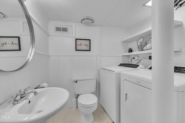 3205 Dell Dr, Raleigh, NC 27609 - bathroom featuring washing machine and dryer and a sink