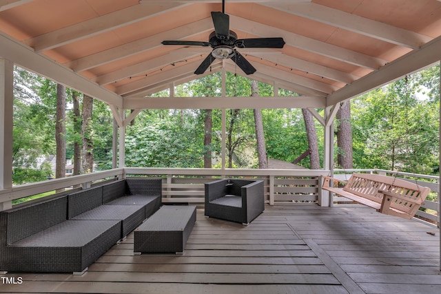 3205 Dell Dr, Raleigh, NC 27609 - wooden deck featuring a ceiling fan, an outdoor hangout area, a gazebo, and view of scattered trees