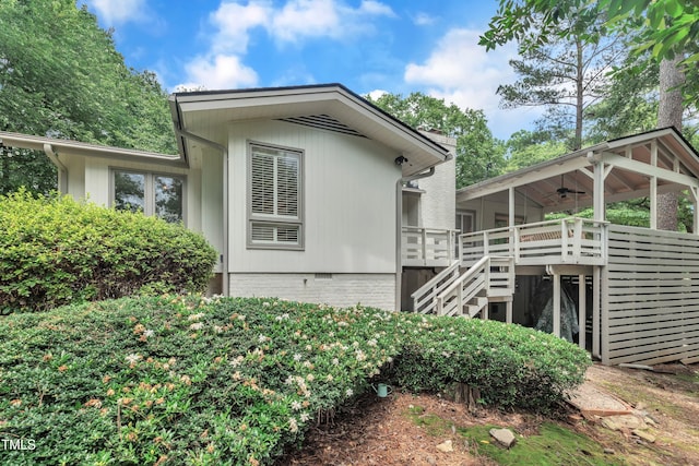 3205 Dell Dr, Raleigh, NC 27609 - rear view of property featuring stairway, ceiling fan, a wooden deck, a sunroom, and crawl space