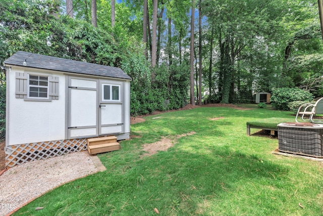 3205 Dell Dr, Raleigh, NC 27609 - view of green lawn featuring a storage unit and view of scattered trees