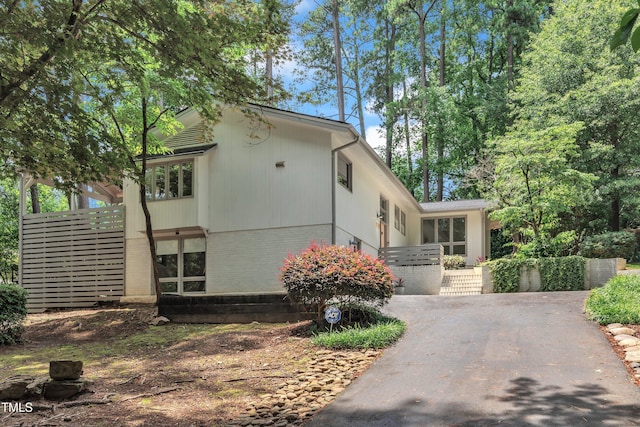 3205 Dell Dr, Raleigh, NC 27609 - view of front of house featuring brick siding and asphalt driveway