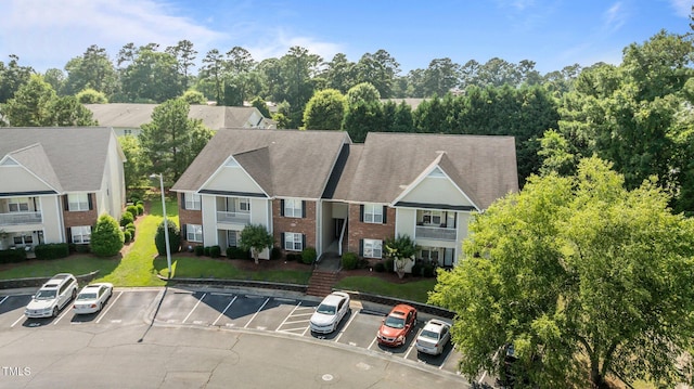 3159 Wisteria Ln Unit 202, Fayetteville, NC 28314 - view of front of property featuring uncovered parking and brick siding