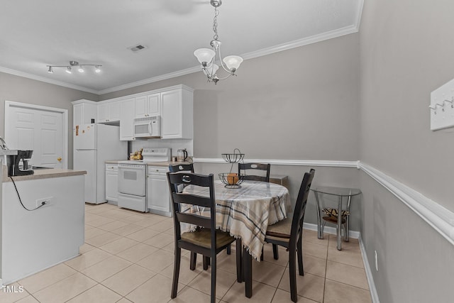 3159 Wisteria Ln Unit 202, Fayetteville, NC 28314 - dining room featuring light tile patterned floors, crown molding, and a chandelier