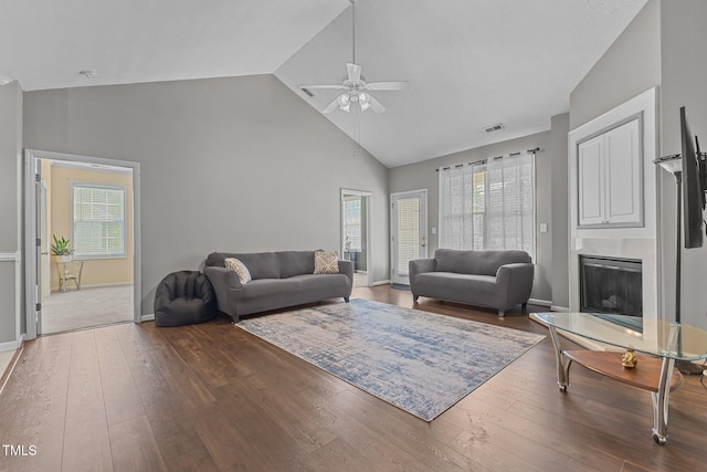 3159 Wisteria Ln Unit 202, Fayetteville, NC 28314 - living area featuring a ceiling fan, high vaulted ceiling, plenty of natural light, hardwood / wood-style floors, and a fireplace with raised hearth