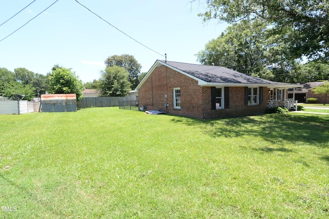 521 S Lombard St, Clayton, NC 27520 - view of property exterior featuring brick siding and a shingled roof