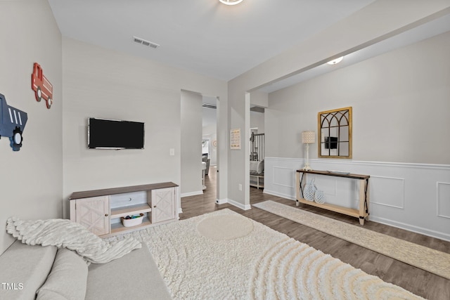 3613 Cross Timber Ln, Raleigh, NC 27603 - bedroom featuring wood finished floors and wainscoting