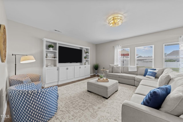 3613 Cross Timber Ln, Raleigh, NC 27603 - living room featuring wood finished floors and built in shelves