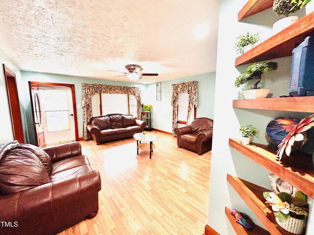 1337 Maple St, Rocky Mount, NC 27803 - living room with wood finished floors, a ceiling fan, and a textured ceiling