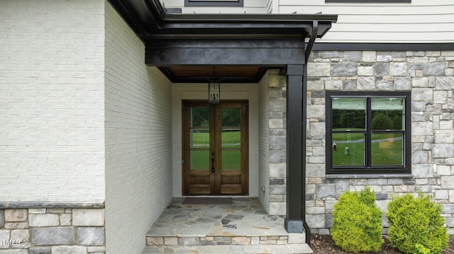 310 Hidden Lake Dr, Youngsville, NC 27596 - doorway to property featuring stone siding and french doors