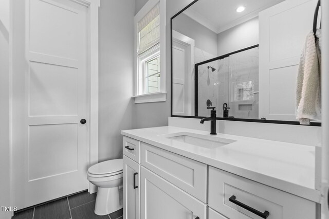 310 Hidden Lake Dr, Youngsville, NC 27596 - full bath with a stall shower, vanity, and crown molding