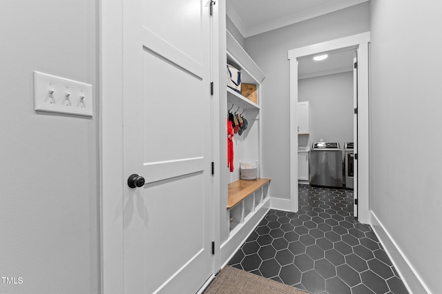 310 Hidden Lake Dr, Youngsville, NC 27596 - mudroom featuring independent washer and dryer, crown molding, and dark tile patterned floors