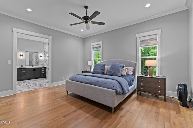 310 Hidden Lake Dr, Youngsville, NC 27596 - bedroom featuring multiple windows, light wood-style floors, crown molding, recessed lighting, and connected bathroom
