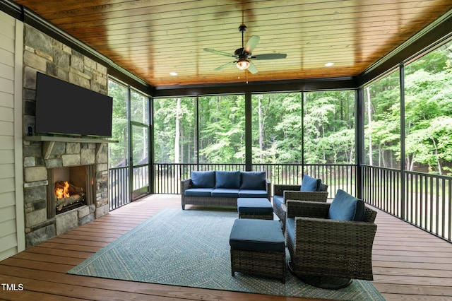 310 Hidden Lake Dr, Youngsville, NC 27596 - sunroom featuring an outdoor living space with a fireplace, a ceiling fan, and healthy amount of natural light