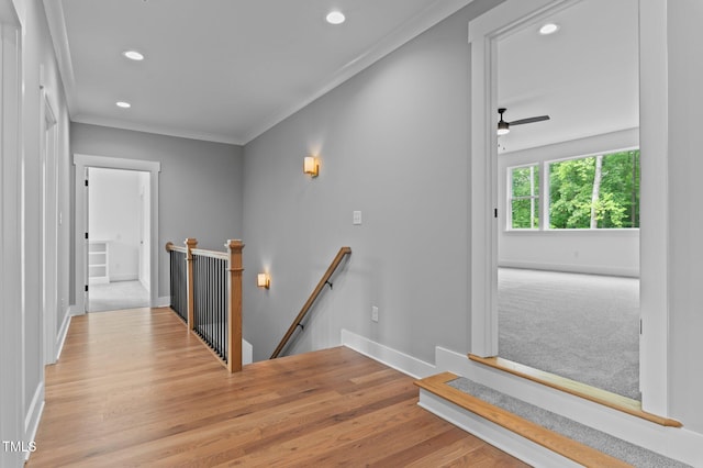 310 Hidden Lake Dr, Youngsville, NC 27596 - corridor featuring an upstairs landing, recessed lighting, wood finished floors, and crown molding
