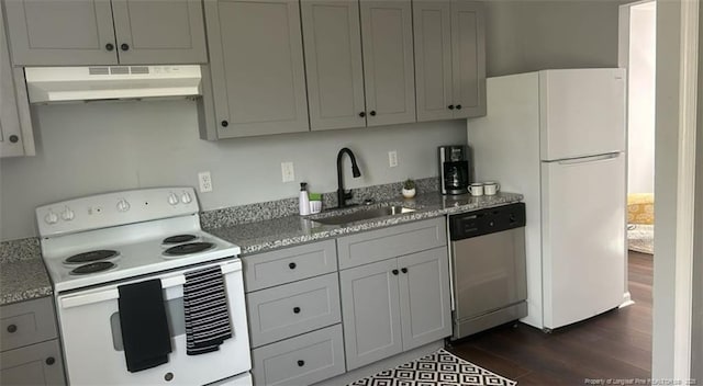 6444 Applecross Ave Unit A, B, C, Fayetteville, NC 28304 - kitchen with white appliances, under cabinet range hood, dark wood finished floors, and light stone counters