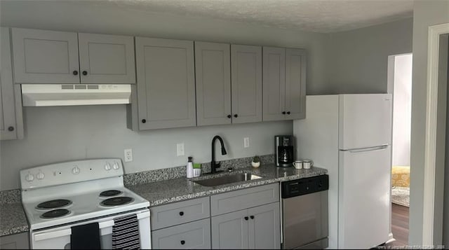 6444 Applecross Ave Unit A, B, C, Fayetteville, NC 28304 - kitchen with under cabinet range hood, white appliances, gray cabinets, and light stone countertops