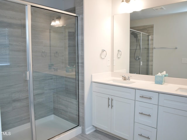 2002 Strickland Oak Way, Durham, NC 27703 - bathroom with double vanity and a shower stall