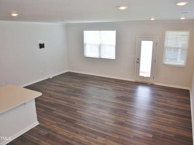 2002 Strickland Oak Way, Durham, NC 27703 - unfurnished living room with ornamental molding, plenty of natural light, dark wood finished floors, and recessed lighting