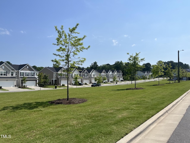 2002 Strickland Oak Way, Durham, NC 27703 - view of home's community featuring a residential view, a yard, and a garage