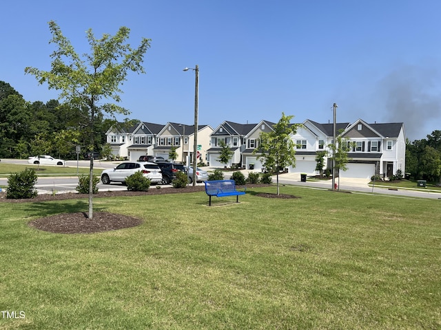 2002 Strickland Oak Way, Durham, NC 27703 - view of green lawn featuring a residential view
