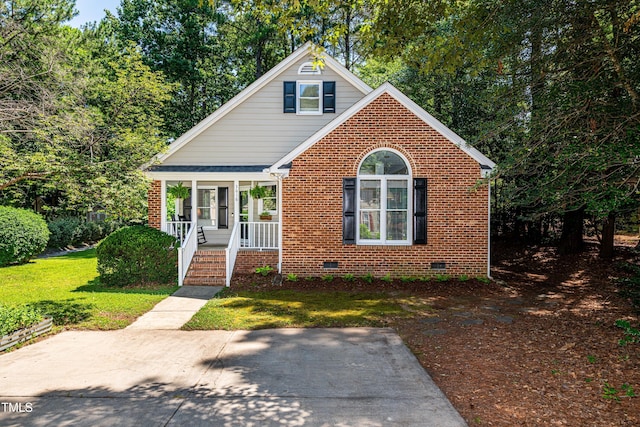 3616 Culater Ct, Raleigh, NC 27616 - bungalow-style house with a porch, crawl space, a front yard, and brick siding