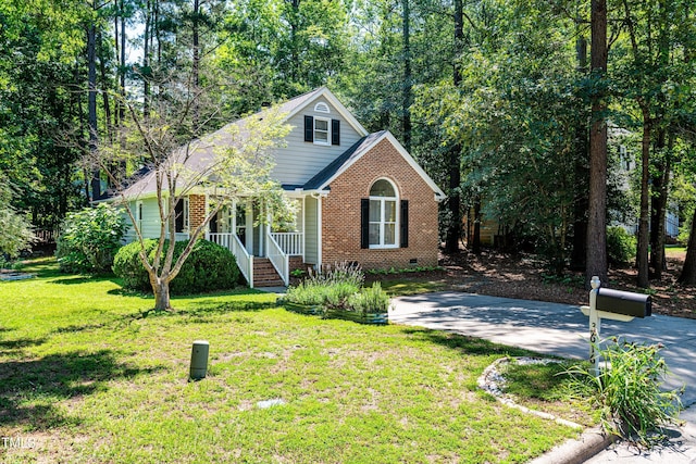 3616 Culater Ct, Raleigh, NC 27616 - view of front of home with a porch, crawl space, brick siding, and a front yard