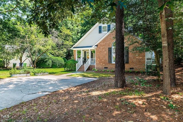 3616 Culater Ct, Raleigh, NC 27616 - view of front of property featuring crawl space, brick siding, and covered porch