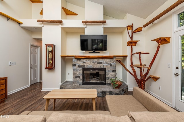 3616 Culater Ct, Raleigh, NC 27616 - living area with wood finished floors, vaulted ceiling, and a fireplace
