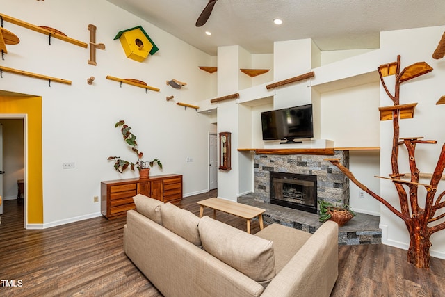 3616 Culater Ct, Raleigh, NC 27616 - living room with wood finished floors, a fireplace, a ceiling fan, recessed lighting, and a textured ceiling