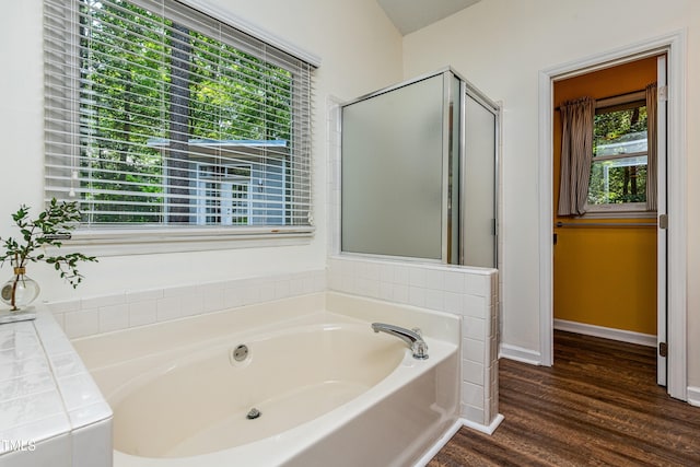 3616 Culater Ct, Raleigh, NC 27616 - bathroom featuring a garden tub and wood finished floors